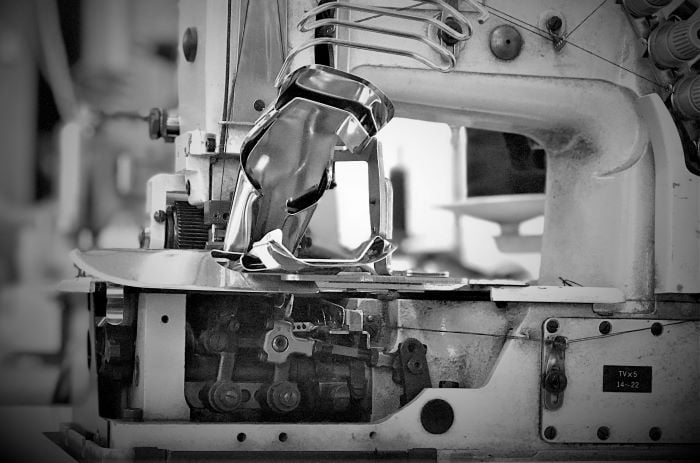 Industrial sewing machine in a high-quality clothing manufacturing facility in Turkey.