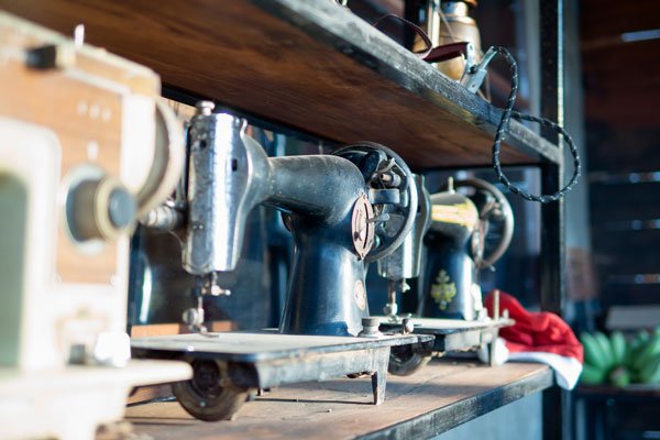 Row of vintage sewing machines in a Turkish clothing manufacturer's workshop