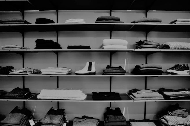 High-quality, ready-made garments displayed on hangers, perfect for building your fashion brand with white label solutions.