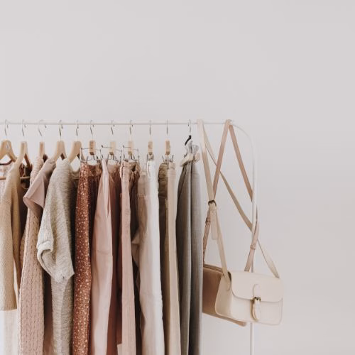 Minimalist clothing collection with neutral tones.