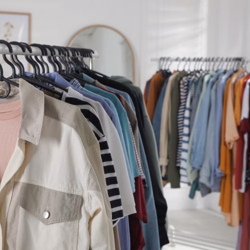 A rack of modern clothing featuring various designs.